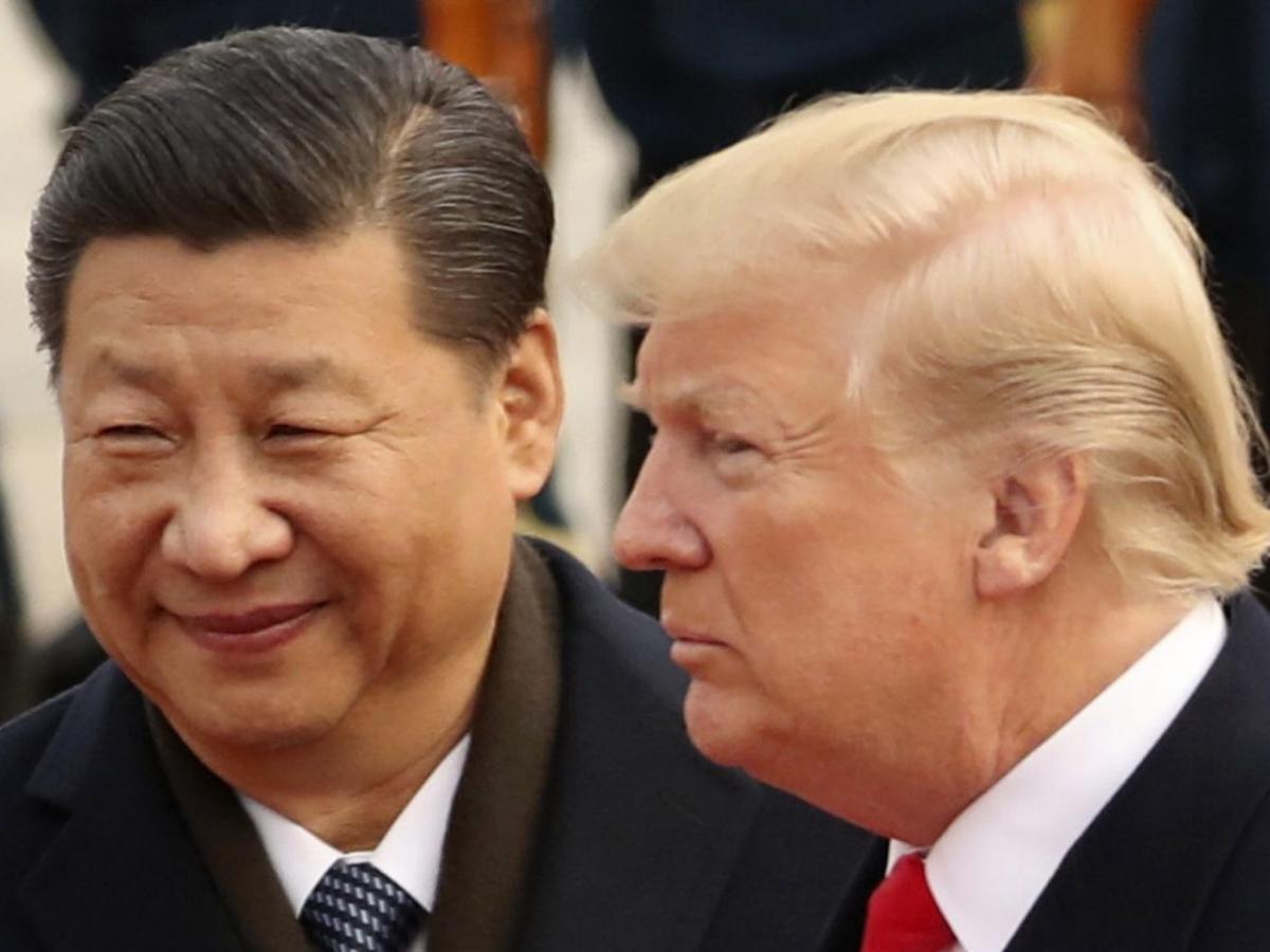 President Xi Jinping and President Trump in Beijing in November 2017 PHOTO: ANDREW HARNIK/ASSOCIATED PRESS